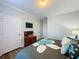 Bedroom with a king-size bed, dresser, and mounted TV at 1361 Tuscan Ter # 7305, Davenport, FL 33896