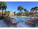Resort-style pool with plenty of lounge chairs for relaxation at 1361 Tuscan Ter # 7305, Davenport, FL 33896