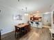 Dining room with wood table and chairs, adjacent to kitchen at 1361 Tuscan Ter # 7305, Davenport, FL 33896