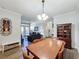 Open dining room with a view of the living room and balcony at 1361 Tuscan Ter # 7305, Davenport, FL 33896
