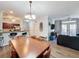 Open concept dining room with a large table and kitchen views at 1361 Tuscan Ter # 7305, Davenport, FL 33896