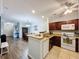 Kitchen with granite countertops, stainless steel appliances, and breakfast bar at 1361 Tuscan Ter # 7305, Davenport, FL 33896