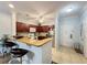 Kitchen with granite countertops, stainless steel appliances, and breakfast bar at 1361 Tuscan Ter # 7305, Davenport, FL 33896