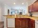 Kitchen with granite countertops, stainless steel appliances, and breakfast bar at 1361 Tuscan Ter # 7305, Davenport, FL 33896
