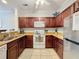 Kitchen with granite countertops, stainless steel appliances, and breakfast bar at 1361 Tuscan Ter # 7305, Davenport, FL 33896