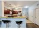 Kitchen with granite countertops, stainless steel appliances, and breakfast bar at 1361 Tuscan Ter # 7305, Davenport, FL 33896