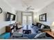 Living room with sectional sofa, coffee table, and flat-screen TV at 1361 Tuscan Ter # 7305, Davenport, FL 33896