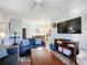 Living room with sectional sofa, coffee table, and flat-screen TV at 1361 Tuscan Ter # 7305, Davenport, FL 33896