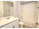 Bathroom with white vanity, tub and tile at 16257 Prairie School Dr, Winter Garden, FL 34787