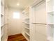 Spacious walk-in closet with ample shelving and hanging rods at 16257 Prairie School Dr, Winter Garden, FL 34787