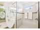 Walk-in shower with built-in seat and decorative accents at 1813 Pelican Hill Way, Poinciana, FL 34759