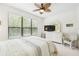 Bright bedroom with a comfortable bed and large window at 1813 Pelican Hill Way, Poinciana, FL 34759