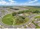 Community overview featuring homes, green spaces, and a central amenity area at 1956 Egret Meadows Ave, Kissimmee, FL 34744