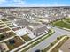 Aerial view of a house and surrounding neighborhood at 1956 Egret Meadows Ave, Kissimmee, FL 34744