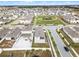 Aerial view of a house and surrounding neighborhood at 1956 Egret Meadows Ave, Kissimmee, FL 34744