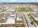 Aerial view of a house and surrounding neighborhood at 1956 Egret Meadows Ave, Kissimmee, FL 34744