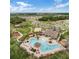 Aerial view of community pool, tennis courts, playground, and surrounding homes at 1956 Egret Meadows Ave, Kissimmee, FL 34744