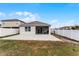 Large backyard with patio and screened enclosure at 1956 Egret Meadows Ave, Kissimmee, FL 34744