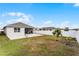 Spacious backyard with patio and partial fence at 1956 Egret Meadows Ave, Kissimmee, FL 34744