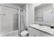 Bathroom with tub, shower, and updated vanity at 1956 Egret Meadows Ave, Kissimmee, FL 34744