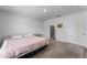 Main bedroom with king-size bed and en-suite bathroom access at 1956 Egret Meadows Ave, Kissimmee, FL 34744