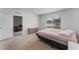 Bright bedroom with a queen-size bed and ample closet space at 1956 Egret Meadows Ave, Kissimmee, FL 34744