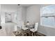 Small dining area with glass table and white chairs at 1956 Egret Meadows Ave, Kissimmee, FL 34744