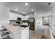 Modern kitchen with island and stainless steel appliances at 1956 Egret Meadows Ave, Kissimmee, FL 34744