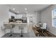 Open floorplan kitchen and dining area with modern finishes at 1956 Egret Meadows Ave, Kissimmee, FL 34744