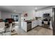 Open concept kitchen and living area with modern finishes at 1956 Egret Meadows Ave, Kissimmee, FL 34744