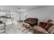 Spacious living room with comfortable seating and a view of the kitchen at 1956 Egret Meadows Ave, Kissimmee, FL 34744