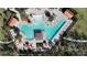 Relaxing resort-style pool with ample lounge chairs and shade structures at 1956 Egret Meadows Ave, Kissimmee, FL 34744