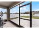 Screened patio with backyard access and a view of the community at 1956 Egret Meadows Ave, Kissimmee, FL 34744