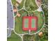 Two tennis courts with red surface and fencing at 1956 Egret Meadows Ave, Kissimmee, FL 34744