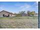 Large backyard with a view of neighboring houses at 22 Peterlee Ct, Kissimmee, FL 34758