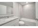 Bathroom with granite countertop and bathtub at 22 Peterlee Ct, Kissimmee, FL 34758