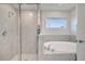 Spa-like bathroom with soaking tub and walk-in shower at 22 Peterlee Ct, Kissimmee, FL 34758