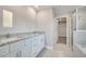 Bathroom with granite countertop, double vanity and shower at 22 Peterlee Ct, Kissimmee, FL 34758