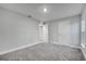 Bright bedroom with grey carpet and two closets at 22 Peterlee Ct, Kissimmee, FL 34758