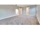 Spacious bedroom with carpet flooring and access to bathroom at 22 Peterlee Ct, Kissimmee, FL 34758