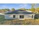 Rear view of house showcasing a sliding glass door at 22 Peterlee Ct, Kissimmee, FL 34758