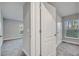 Hallway connecting bedrooms with carpet and natural light at 22 Peterlee Ct, Kissimmee, FL 34758