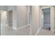 Clean hallway with tile flooring and doors at 22 Peterlee Ct, Kissimmee, FL 34758