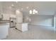 Modern kitchen with white cabinets, granite countertops, and stainless steel appliances at 22 Peterlee Ct, Kissimmee, FL 34758