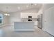 Open kitchen with white cabinets, granite countertops and stainless steel appliances at 22 Peterlee Ct, Kissimmee, FL 34758