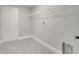 Laundry room with shelving and tile flooring at 22 Peterlee Ct, Kissimmee, FL 34758