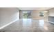 Open concept living area with tile flooring and lots of natural light at 22 Peterlee Ct, Kissimmee, FL 34758