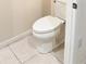 Clean bathroom with a toilet and tile flooring at 2274 Centerra Loop, Kissimmee, FL 34741