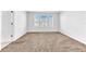 Bright bedroom with neutral carpeting and window at 2274 Centerra Loop, Kissimmee, FL 34741