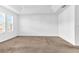 Spacious bedroom with neutral carpeting and large windows at 2274 Centerra Loop, Kissimmee, FL 34741